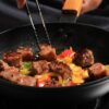 Diced Beef being fried in a pan