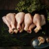 Selection of chicken wings displayed on a wood surface.