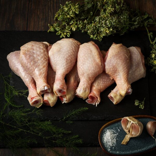 Selection of chicken wings displayed on a wood surface.