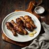 Golden-brown baked chicken drumsticks arranged on a plate